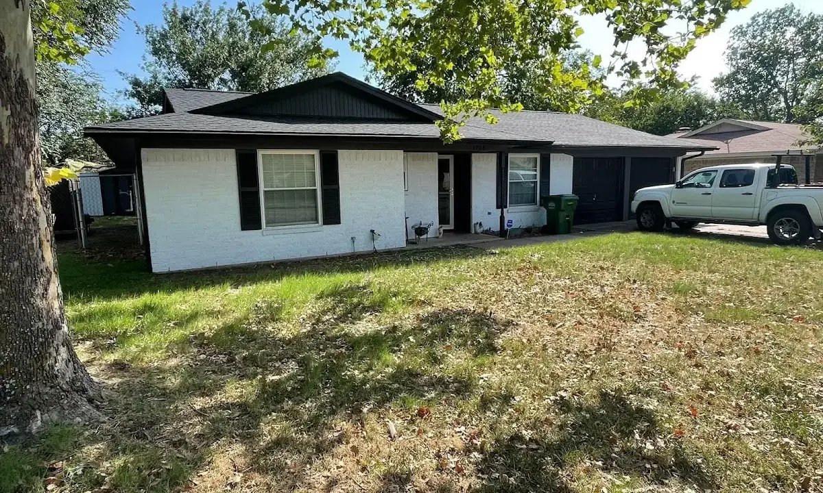 Professional roofing crew working on a residential roof in Skowhegan